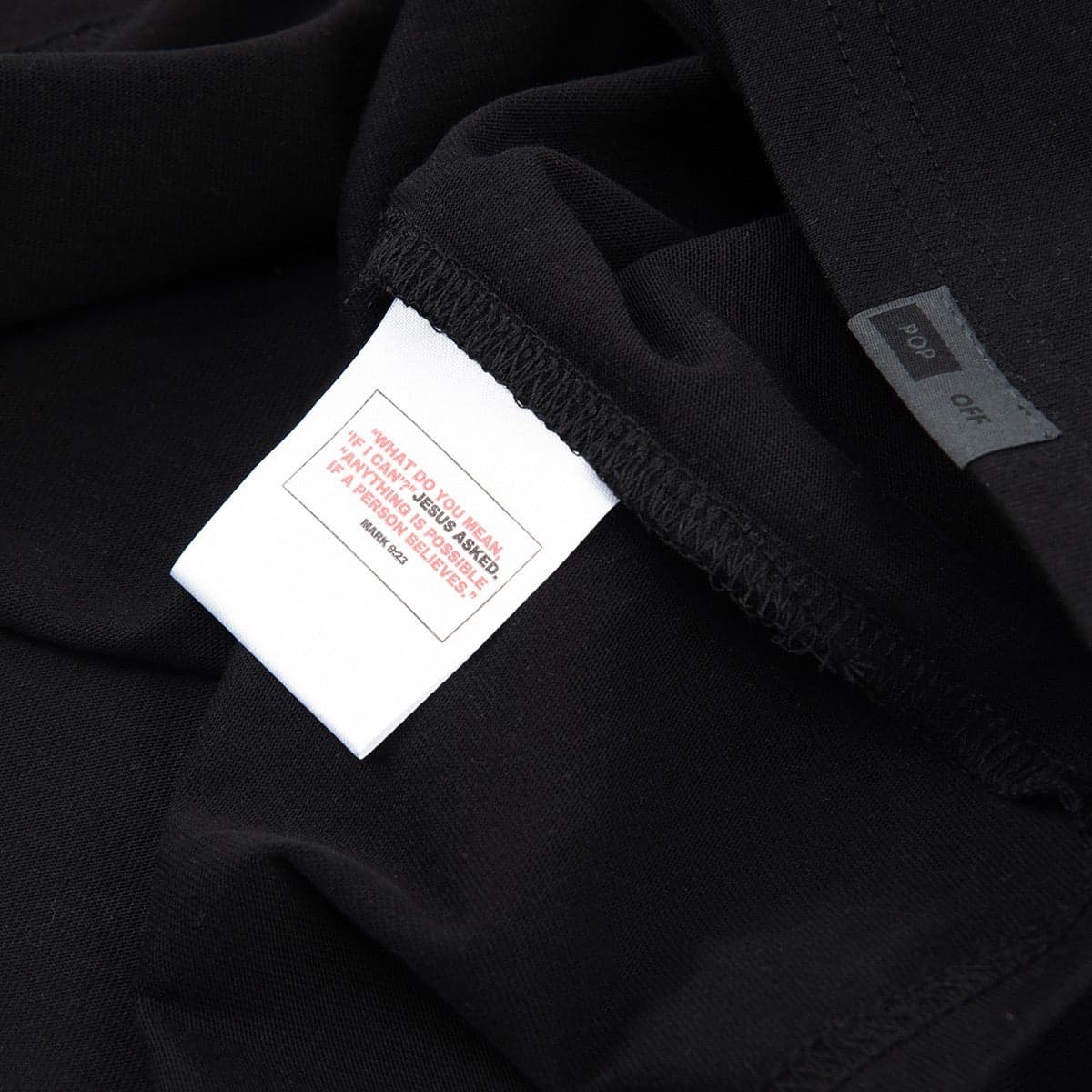Inside care label on the Better Believe It tee